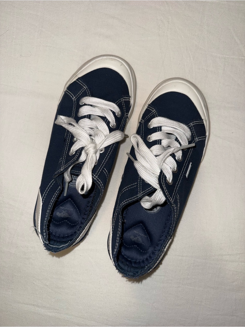 Navy and white Rocket Dog sneakers